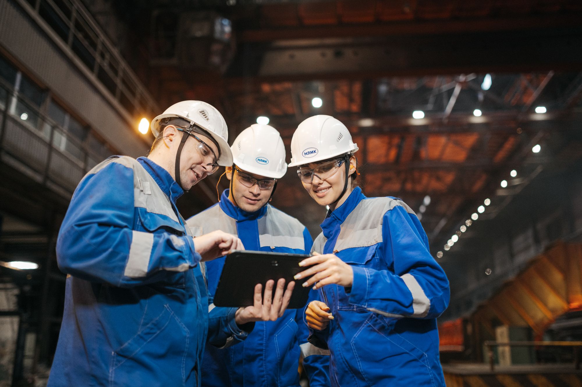 Industrial team wearing personal protective equipment on site